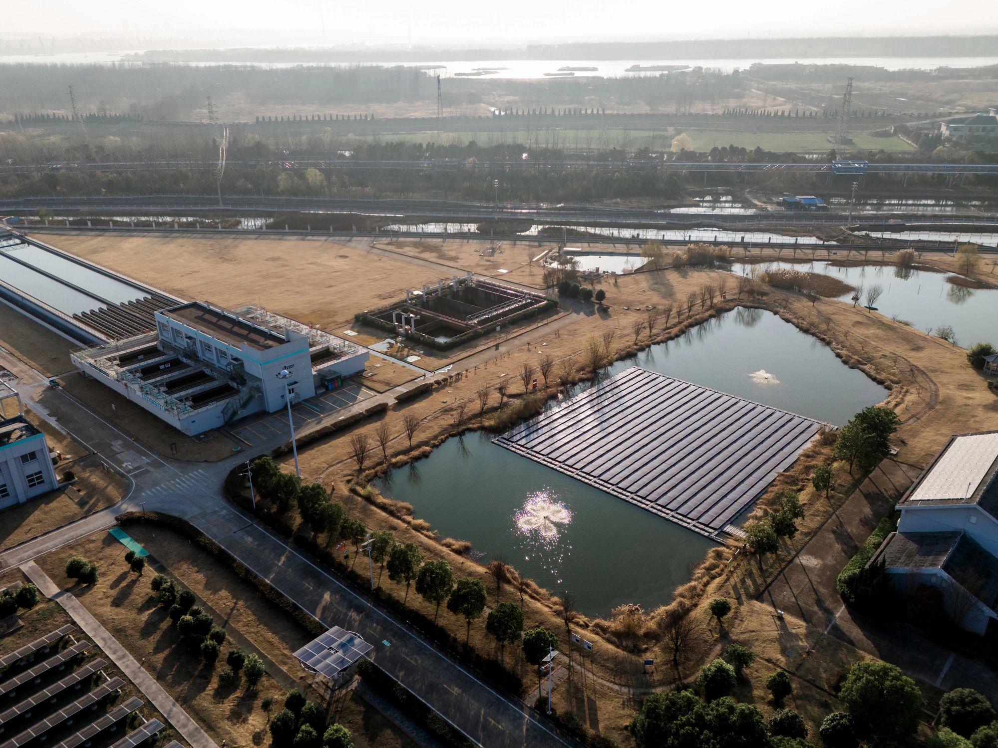 Aerial view of industrial solar panels installed in a field